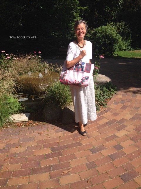 Art lover in Berlin showing off her beautiful weekender bag by Boulder artist Tom Roderick.
