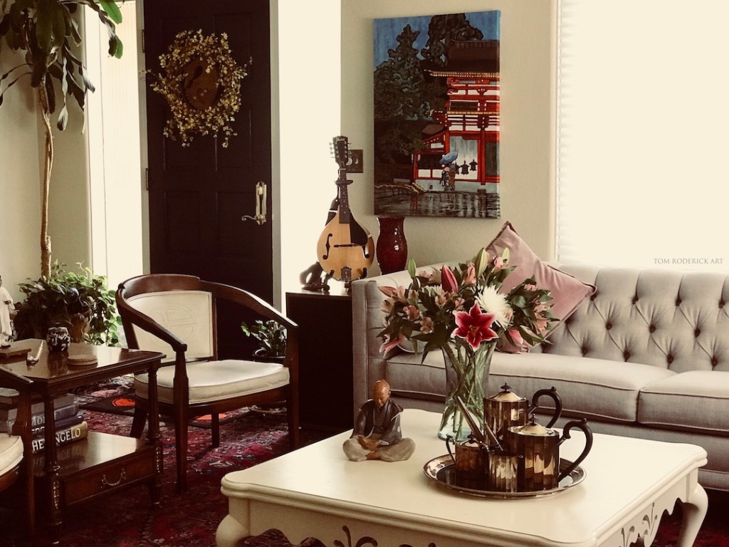 Beautiful room with asian print and floral arrangment.