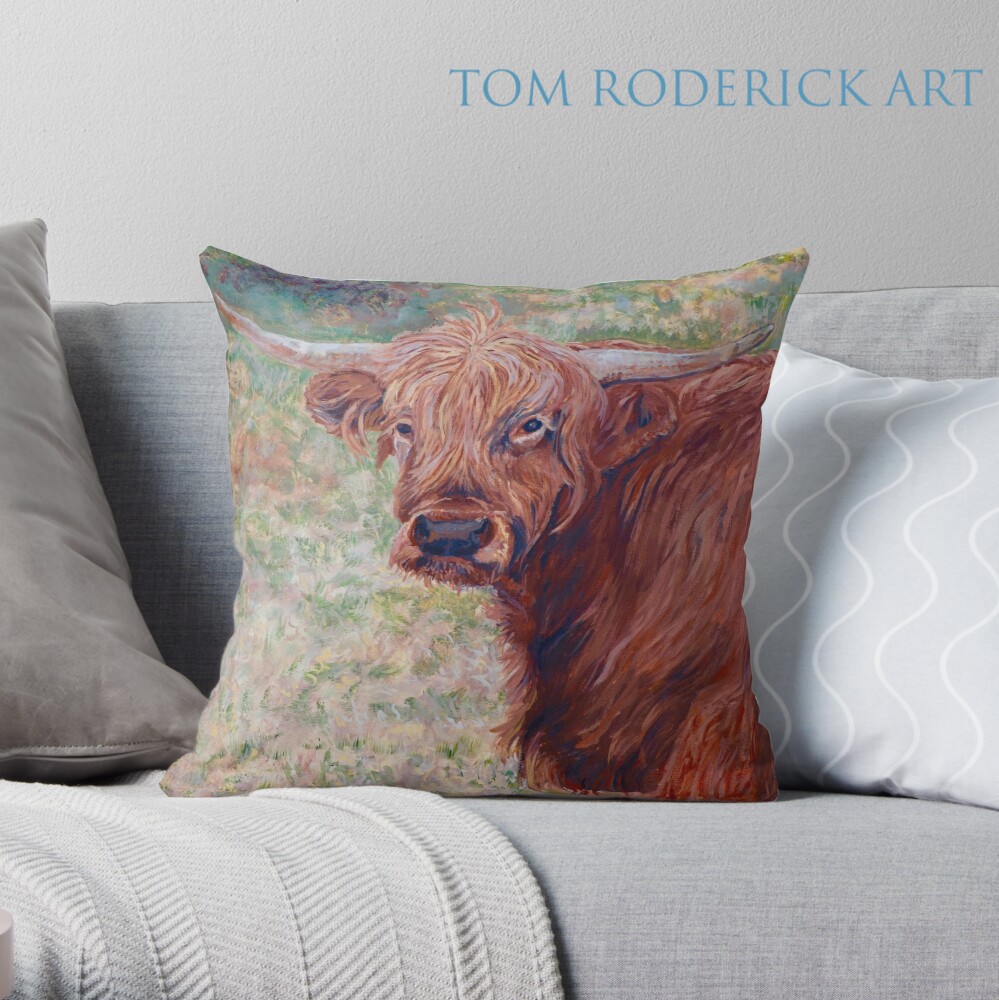 Throw pillow of Wink the Highland Cow by Boulder artist Tom Roderick.